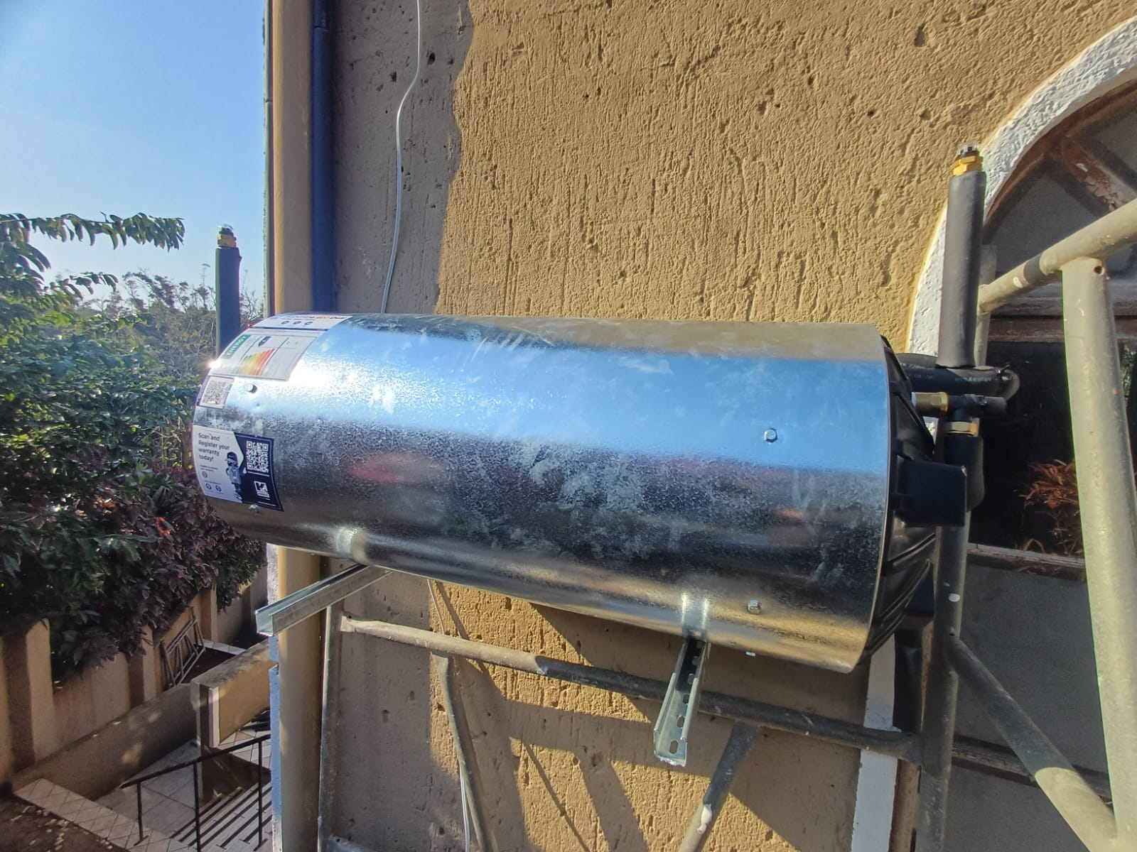 New geyser mounted on brackets with fitted valves and pipework